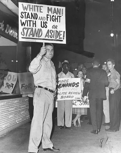 Robert Giles, a 28-year-old member of the American Nazi party, protests against civil rights advocates on August 29, 1963.