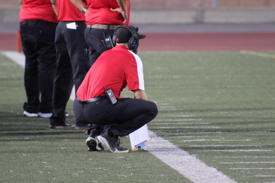 Coach Jacob Ochoa watches his team from the sidelines.