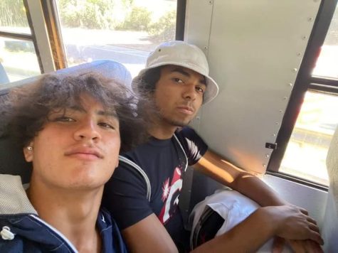 Ethan Faria (left) poses on the bus with his teammate, Mateo Mireles.