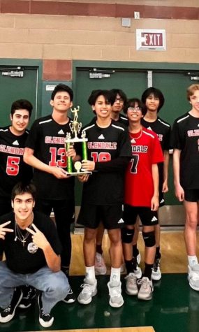 Quan Tran (center) celebrates with his teammates, after a second-place finish at a volleyball tournament in Monrovia.