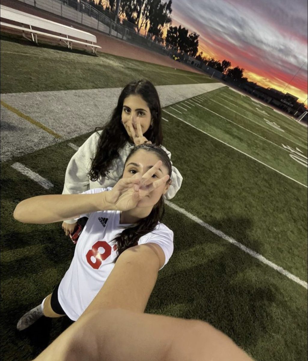 Nelia Ranjbar (back) takes a selfie with teammate, Elena Shakhbandaryan.