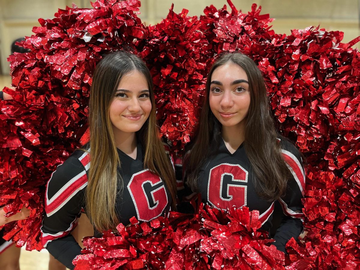 Adri Fenyes (left) poses with fellow senior, Talia Arotionians, who attends Clark Magnet High School