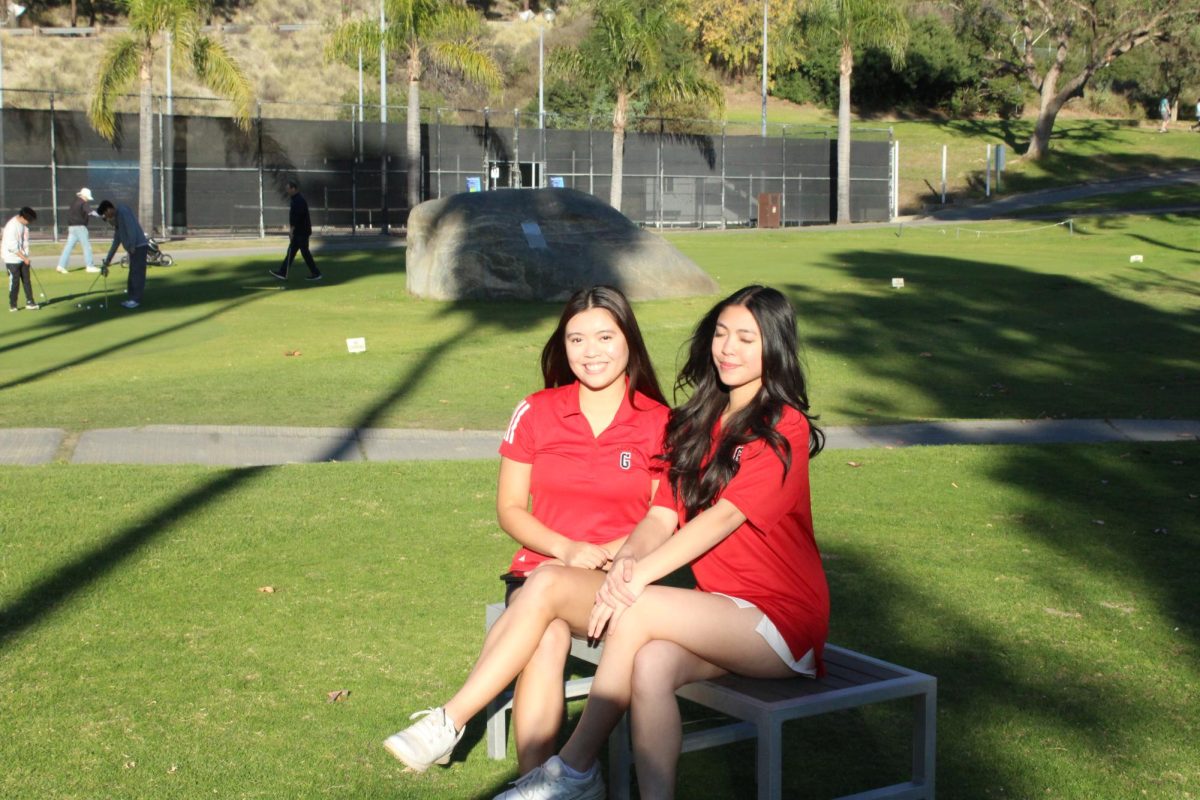 Erynn Padillo (right) poses with her sister, Jeanne, during last year's golf season.