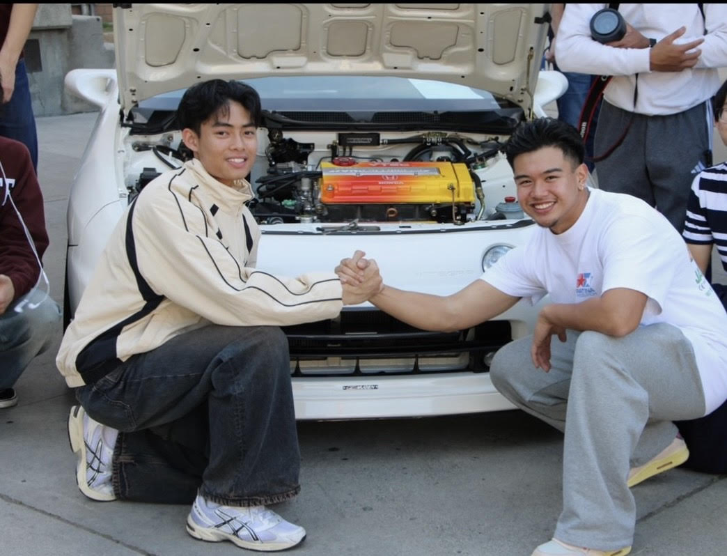 Anthony Alfaro (right) shares a moment with Brent Sales at the Glendale Car Show.
